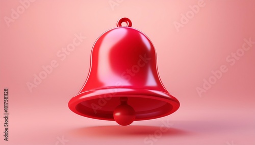 A shiny red bell against a soft pink background, symbolizing alertness and festive occasions.