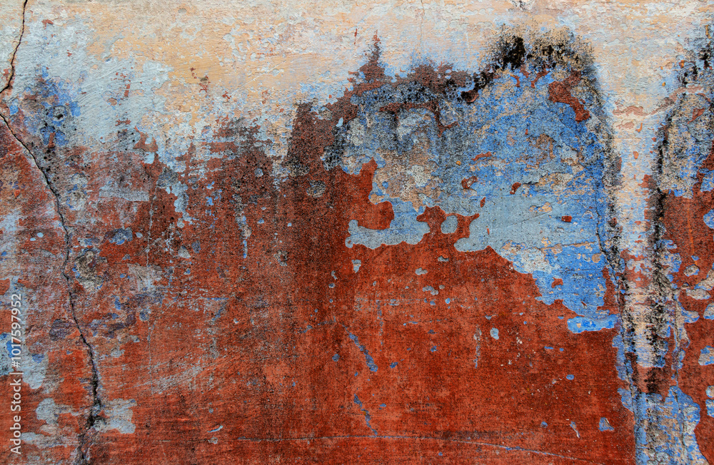 Fototapeta premium Old grunge wall with blue and red paint. Abstract background for design.