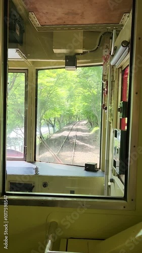 Train moving on the railway in country side in Kyoto, Japan