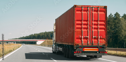 Obraz na płótnie Freight truck with red container on highway w salonie