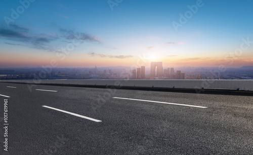 Majestic Urban Landscape at Sunset with Open Road Perspective