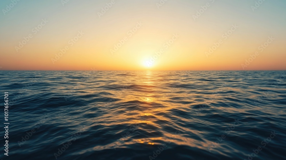 Breathtaking Golden Sunset Reflecting on the Calm Serene Surface of an Expansive Ocean Horizon Under a Clear Warm Sky