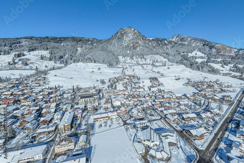 Bad Hindelang im Ostrachtal im Oberallgäu an einem sonnigen Wintertag von oben photo