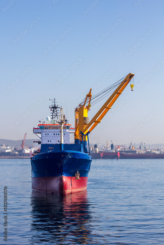 Fototapeta premium the cargo ship and the crane images