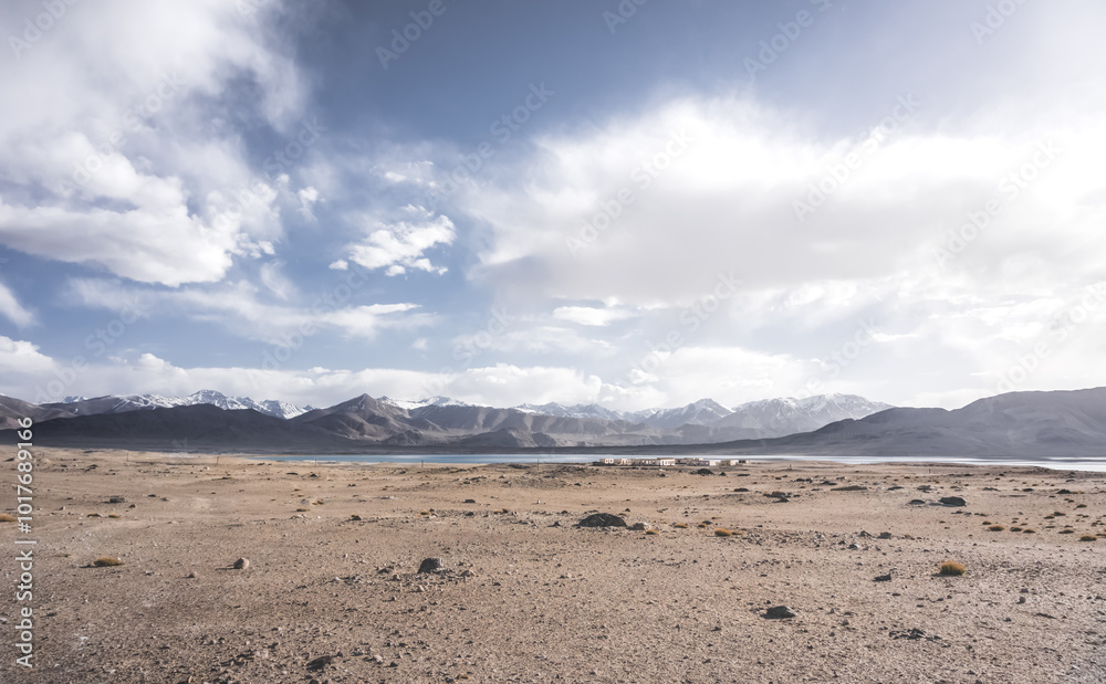 Panoramic landscape of textured Tien Shan mountains in Pamir in Tajikistan, panoramic landscape of a mountain range with snow and glaciers in summer Panoramic landscape of textured Tien Shan mountains in Pamir in Tajikistan, panoramic landscape of a mountain range with snow and glaciers in summer
