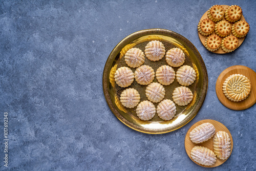 Arabic sweets. Traditional eid semolina maamoul or mamoul cookies with dates , walnuts and pistachio nuts . Top view photo