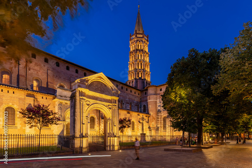 The UNESCO World Heritage Sites of the Basilica of Saint-Sernin in Toulouse during twilight. The bell tower, stands directly over the transept crossing and most visible feature