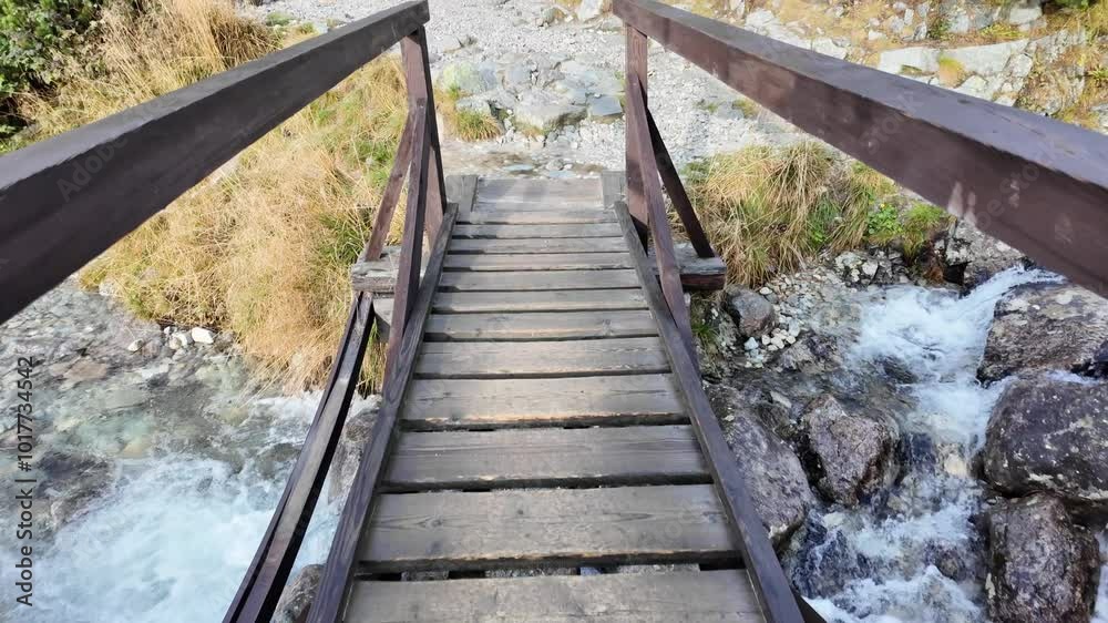 A bridge over a stream in the Slovak Tatras. Direction Rysy. A bridge over a stream in the Slovak Tatras. Direction Rysy.