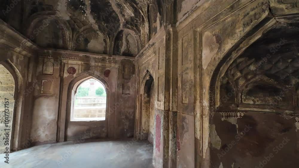  Intricate  floral fresco on a medieval tomb's weathered wall in Jhajjar, Haryana, India.