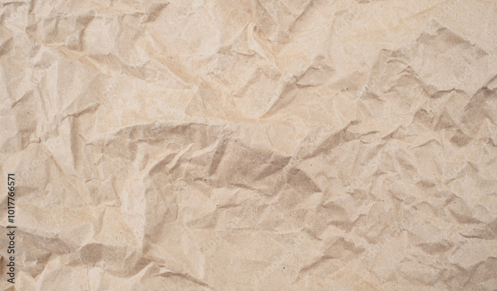 Recycled brown creased paper background from a paper packing. Crumpled brown paper texture concept Recycled brown creased paper background from a paper packing. Crumpled brown paper texture concept