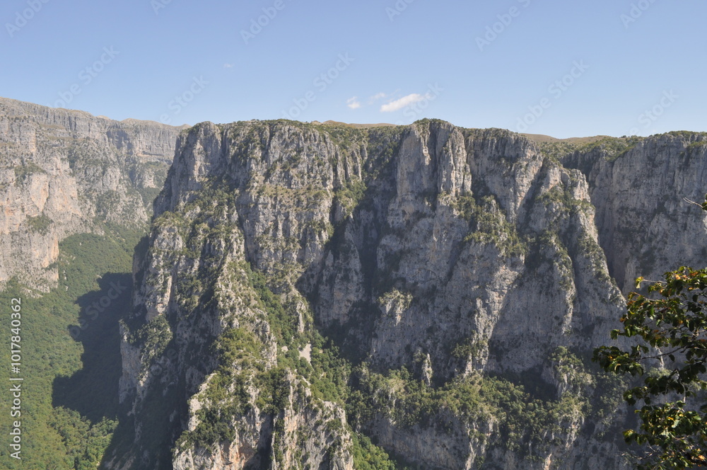 Vikos Gorge nature path in Greece. A beautiful nature trail winding through forests, mountains, cliffs, and lakes Vikos Gorge nature path in Greece. A beautiful nature trail winding through forests, mountains, cliffs, and lakes