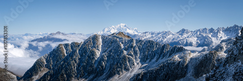 sunning panoramic view of the Mont Blanc in autumn. Snowy mountains in autumn in the french alps. beautiful colors, blue sky, sea of clouds