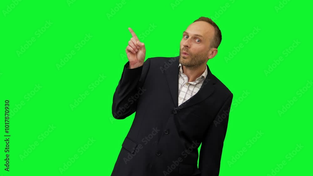 A confident businessman in a suit stands against a green screen, using dynamic hand gestures to emphasize his points during a presentation. This footage is ideal for corporate videos, training materia A confident businessman in a suit stands against a green screen, using dynamic hand gestures to emphasize his points during a presentation. This footage is ideal for corporate videos, training materia