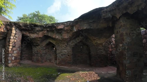  Exploring the beautiful medieval  structure amidst lush greenery at Feroz shah kotla fort, Delhi, India  photo