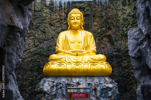 Samut Sakhon, Thailand - September, 25, 2024 : Golden Buddha Statue in Serene Cave in Lak Si Temple at Samut Sakhon, Thailand. photo