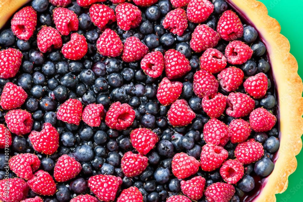 Pie with greens and berries on white. dessert food cake concept. a round pie with berries on a green . a round pie with berries and greens on lifestyle a. Pie with greens and berries on white. dessert food cake concept. a round pie with berries on a green . a round pie with berries and greens on lifestyle a.