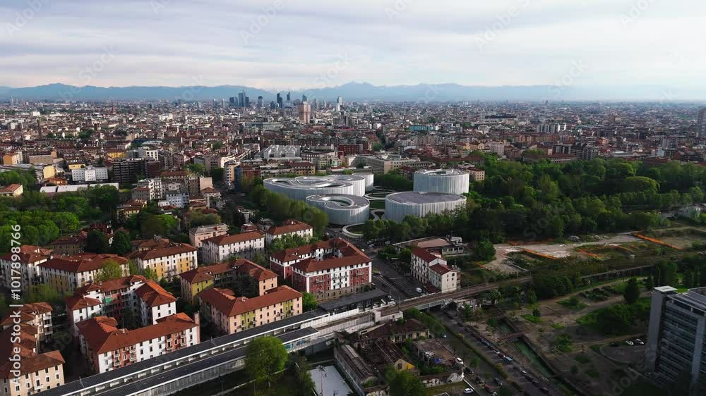 drone fly above famous Bocconi University with panoramic view of Alps mountains at distance drone fly above famous Bocconi University with panoramic view of Alps mountains at distance