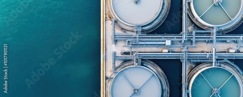 Aerial view of water treatment tanks showcasing modern infrastructure for efficient wastewater management and purification processes.