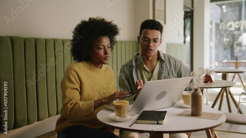 Mixed race co-workers discussing important business ideas