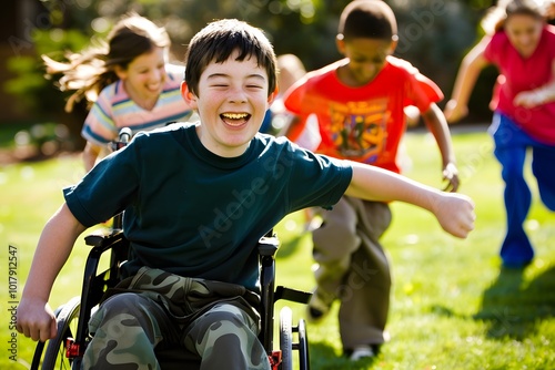 Fototapeta Naklejka Na Ścianę i Meble -  A group of diverse children playing together outdoors, with a happy boy in a wheelchair leading the fun in a sunny park