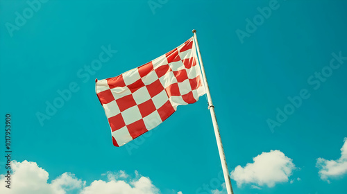 Red and White Checkered Flag Waving in the Wind.