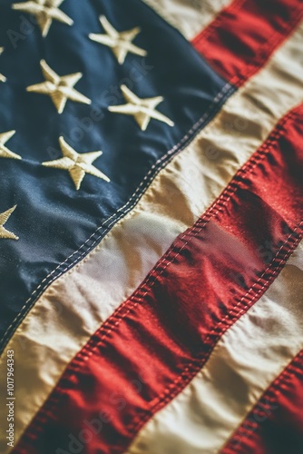 American flag illuminated by sunlight, showcasing rich colors and detailed st...
