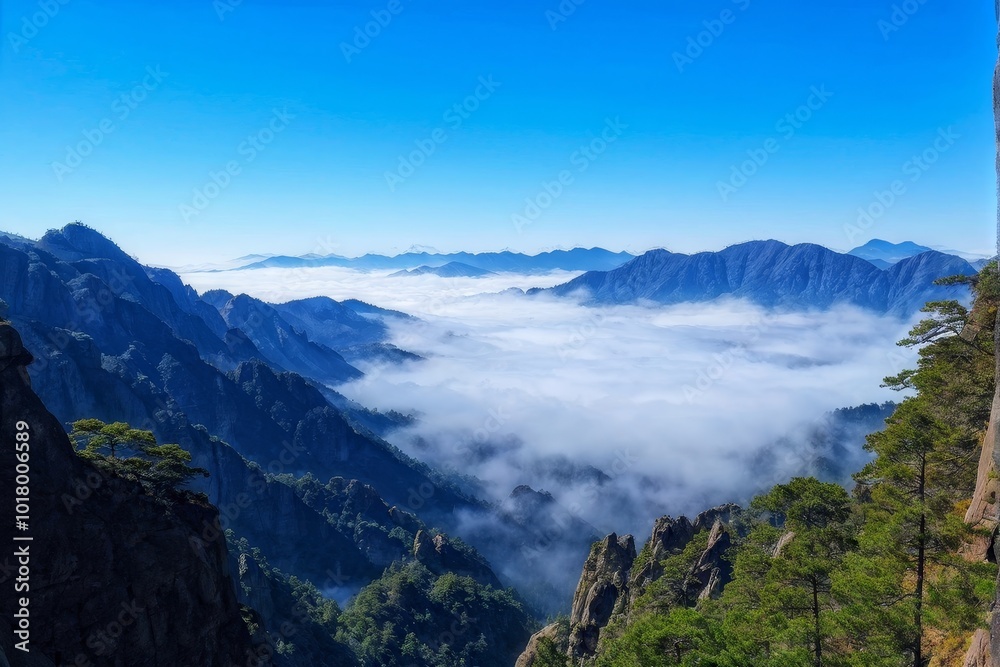 Naklejka premium Misty Valley Surrounded by Majestic Mountain Peaks