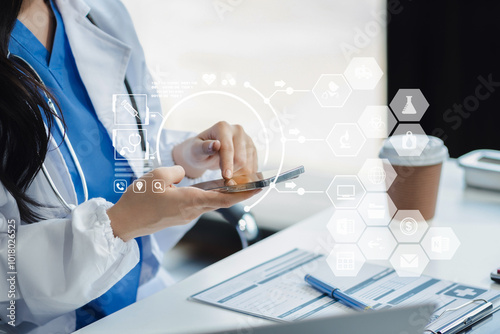 Doctor working with a tablet and smartphone search for medical information at the hospital office during the day. photo