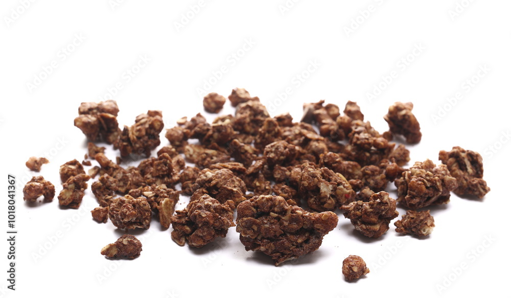 Crunchy granola, muesli pile with chocolate isolated on white background, side view Crunchy granola, muesli pile with chocolate isolated on white background, side view
