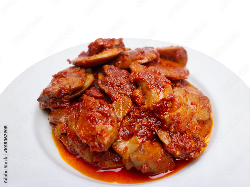 Jengkol Balado or dogfruit with red chili sauce, a spicy traditional Indonesian dish from West Sumatra, served on a white plate with a clean white background Jengkol Balado or dogfruit with red chili sauce, a spicy traditional Indonesian dish from West Sumatra, served on a white plate with a clean white background