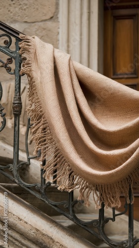 Cozy Blanket Draped Over Elegant Railing