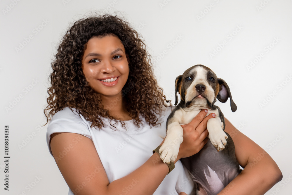 Girl and her dog are on white . pet animal young concept. girl holding dog in her hands on white . a girl with a dog in her hands is holding a dog on a lifestyle white. Girl and her dog are on white . pet animal young concept. girl holding dog in her hands on white . a girl with a dog in her hands is holding a dog on a lifestyle white.