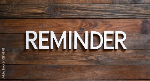 reminder lettering on wooden wall planks background