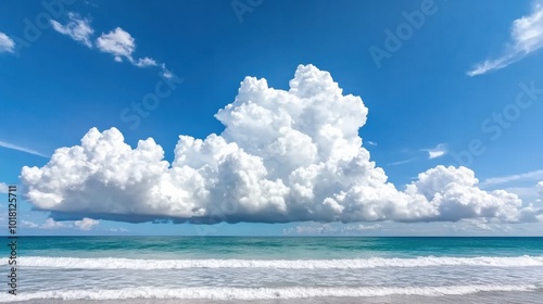 Serene Beach Scene with Dramatic Cloud Formation