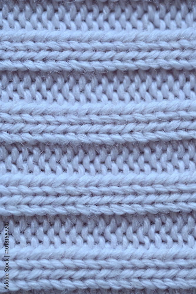 Macro texture of elastic of wool blue crocheted sweater as background, close-up of pastel blue crocheted front, blue crocheted back, texture of wool wool, blue crocheted front Macro texture of elastic of wool blue crocheted sweater as background, close-up of pastel blue crocheted front, blue crocheted back, texture of wool wool, blue crocheted front