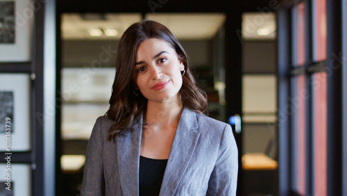 Portrait Of Serious Young Businesswoman Working In Modern Open Plan Office Free Download Portrait Of Serious Young Businesswoman Working In Modern Open Plan Office - GFXLoad