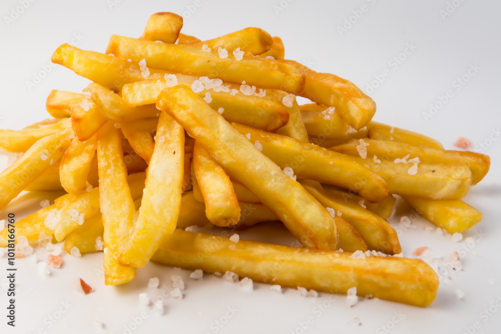 White plate with fries and fries on it on a . food meal concept. a handful of fries on a white with salt and pepper. a handful of fries with salt and pepper are sprinkled on the lifestyle. White plate with fries and fries on it on a . food meal concept. a handful of fries on a white with salt and pepper. a handful of fries with salt and pepper are sprinkled on the lifestyle.
