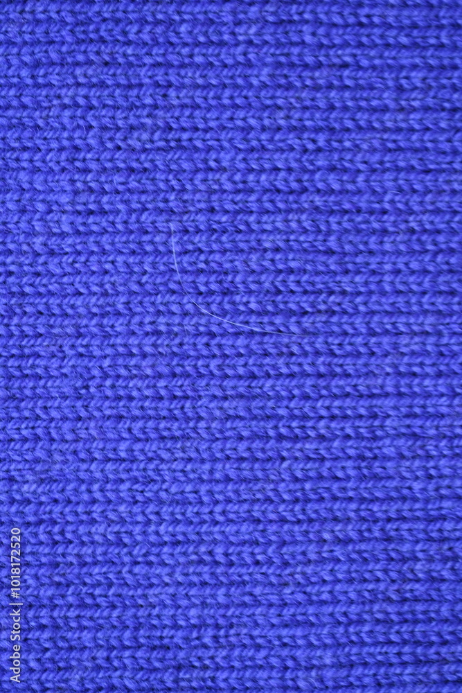 Macro texture of purple wool crochet sweater as background, close-up of purple crochet front surface, texture of woolen wool, crochet front surface Macro texture of purple wool crochet sweater as background, close-up of purple crochet front surface, texture of woolen wool, crochet front surface