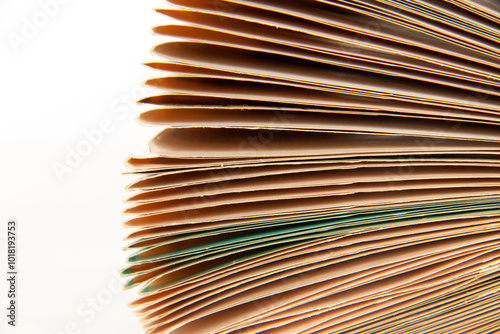 Fragment of an open old book with pages joined together and bruised. Each sheet folded inwards