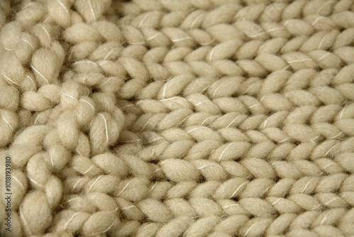 Fragment of very thick wool texture in beige with white interlaced thread