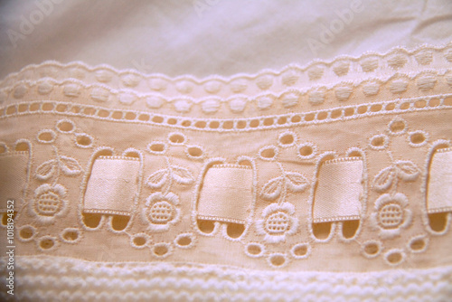 Fragment of preparation of clothing for baby baptism detail ribbon dress entredeux