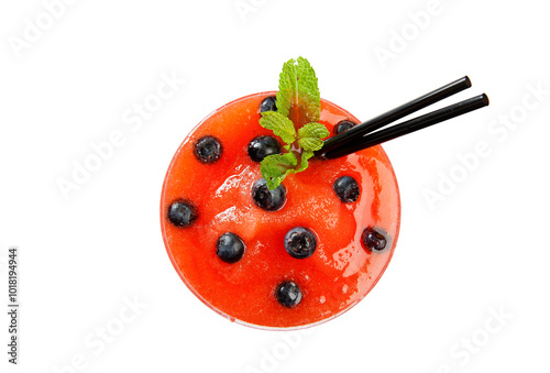 Overhead shot of strawberry and blueberry cocktail glass with mint garnish and two black straws on white background