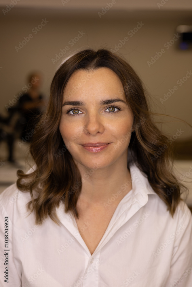 portrait of a beautiful girl in a white blouse with dark hair smiling portrait of a beautiful girl in a white blouse with dark hair smiling
