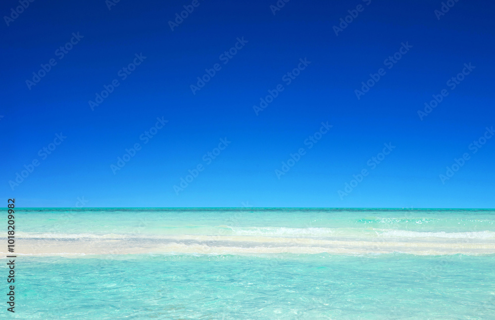 Beach and beautiful tropical sea. Blue sunny sea water surface Beach and beautiful tropical sea. Blue sunny sea water surface