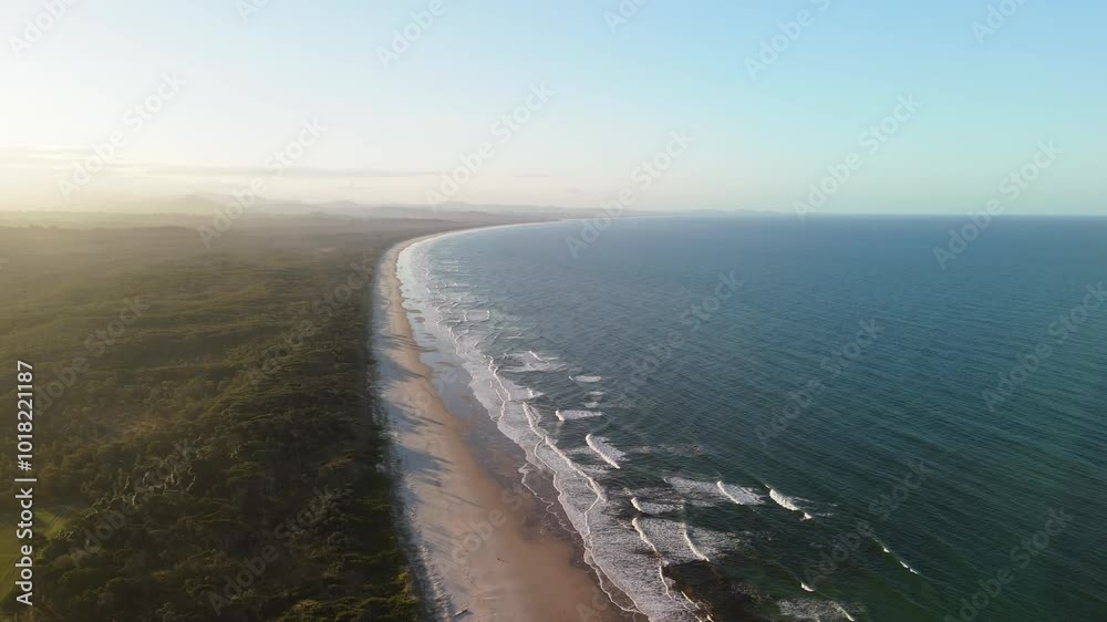 Cinematic flight at sunrise over Byron Bay beach in Australia Cinematic flight at sunrise over Byron Bay beach in Australia