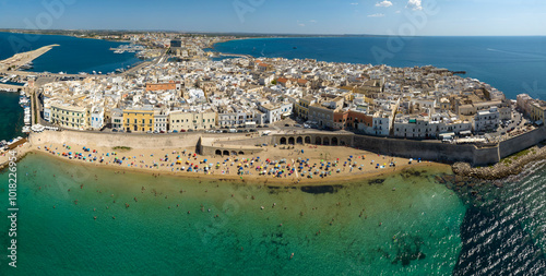 Fototapeta Naklejka Na Ścianę i Meble -  Panoramic aerial view of Spiaggia della Purità (Purity Beach) in the historic center of Gallipoli, a city in the province of Lecce, Salento, Puglia, Italy. The old town overlooks the Mediterranean Sea