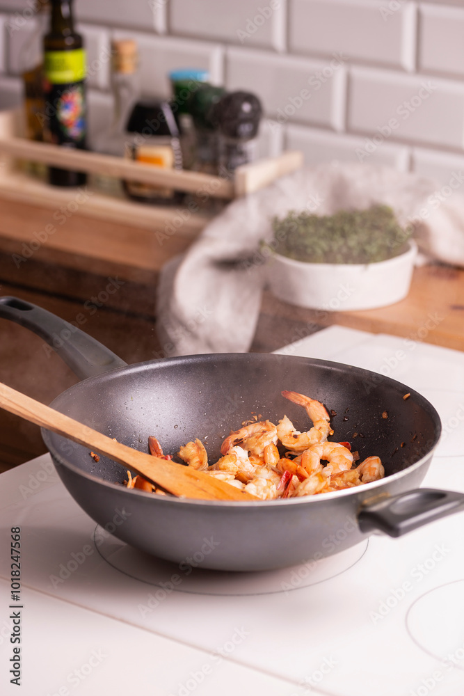 Cooking shrimp in a frying pan Cooking shrimp in a frying pan