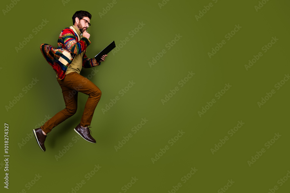 Photo of pensive clever smart man wear stylish clothes walk empty space isolated on khaki color background Photo of pensive clever smart man wear stylish clothes walk empty space isolated on khaki color background