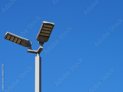 Electro-energy technologies. A modern street LED lighting pole. LED Street Light on blue sky, cloud background.  Outdoor LED Lighting. Solar panel street light - Eco-friendly
 photo