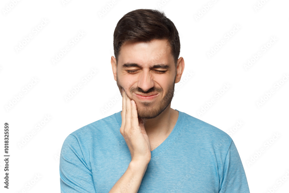 Young man with closed eyes suffering from severe toothache, touching jaw with fingers trying to ease strong tooth pain Young man with closed eyes suffering from severe toothache, touching jaw with fingers trying to ease strong tooth pain